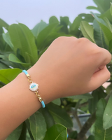 Light blue azure evil eye charm thread rakhi